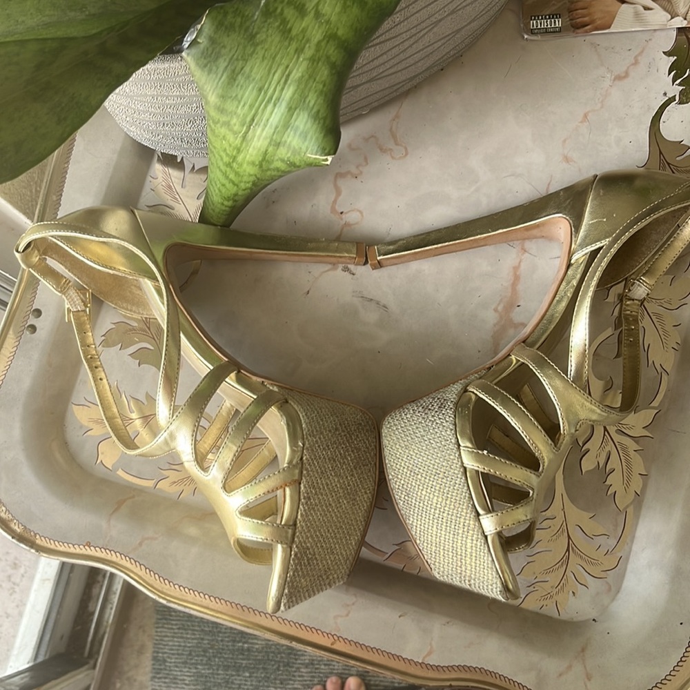Golden metallic stiletto heels in good previously loved condition